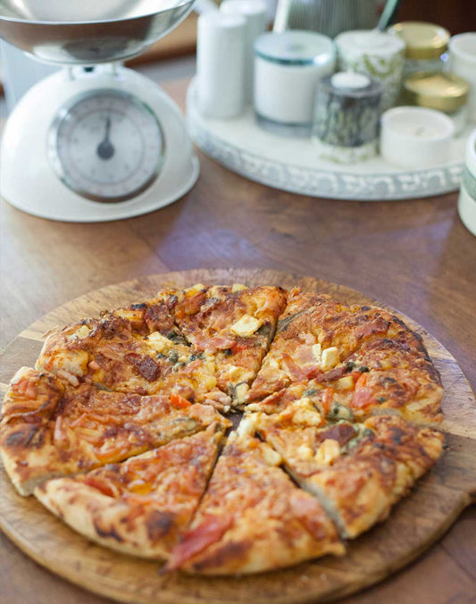 A homemade pizza made on the Earth and Nectar farm